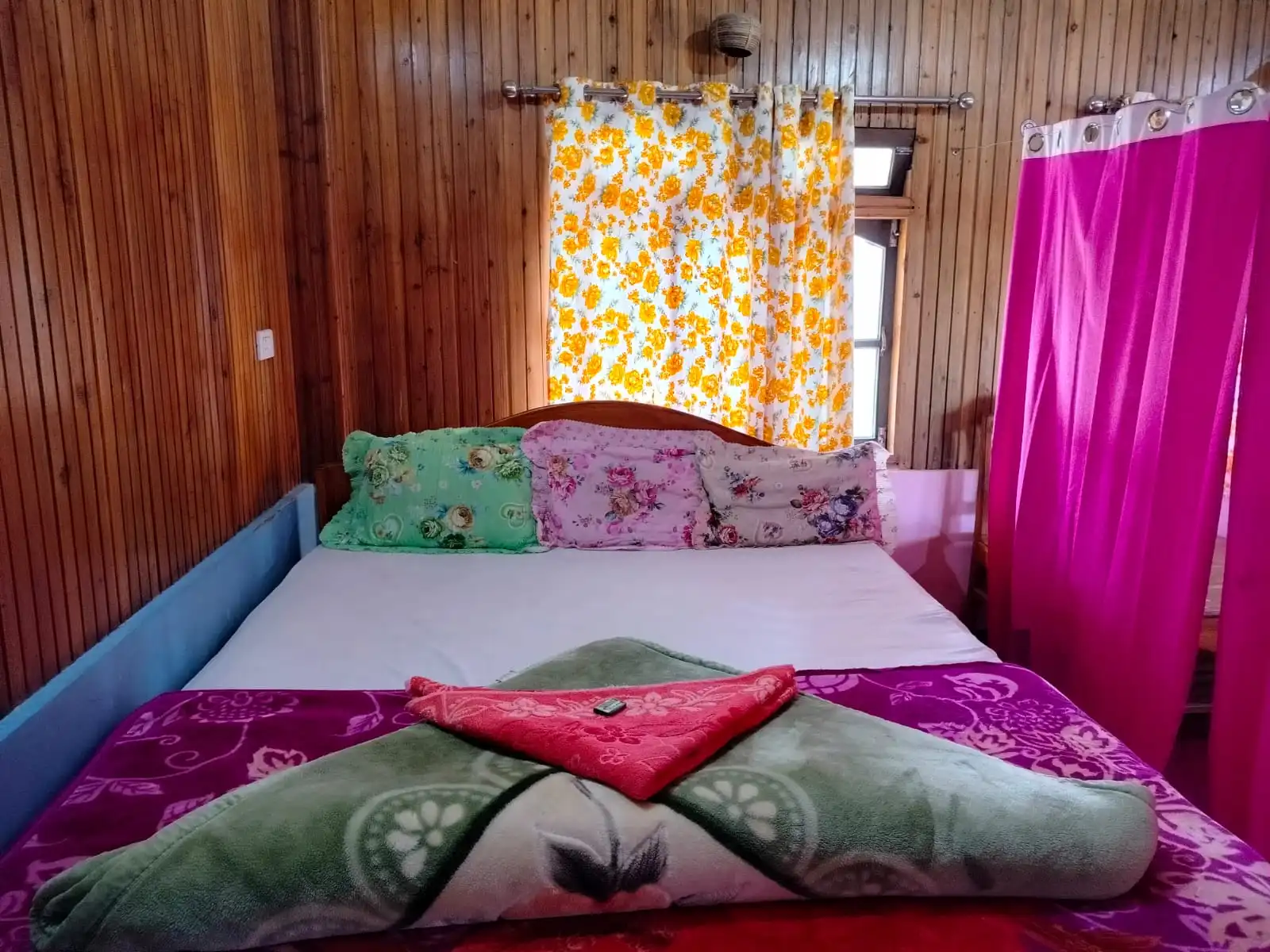 View of tea gardens and Kanchenjunga from wooden cottage at top Sittong homestay